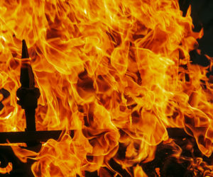 Wind-Driven Fire Spread to a Structure from Composite Fences